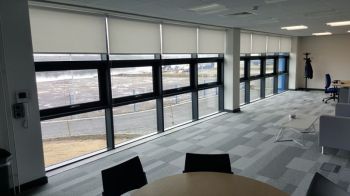 1. Privacy vinyl to all lower panes and logos to clients specifications to entrance Newcastle University