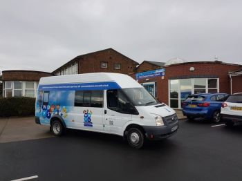 4. Minibus wrapped with printed contravision on Windows West Denton Primary School